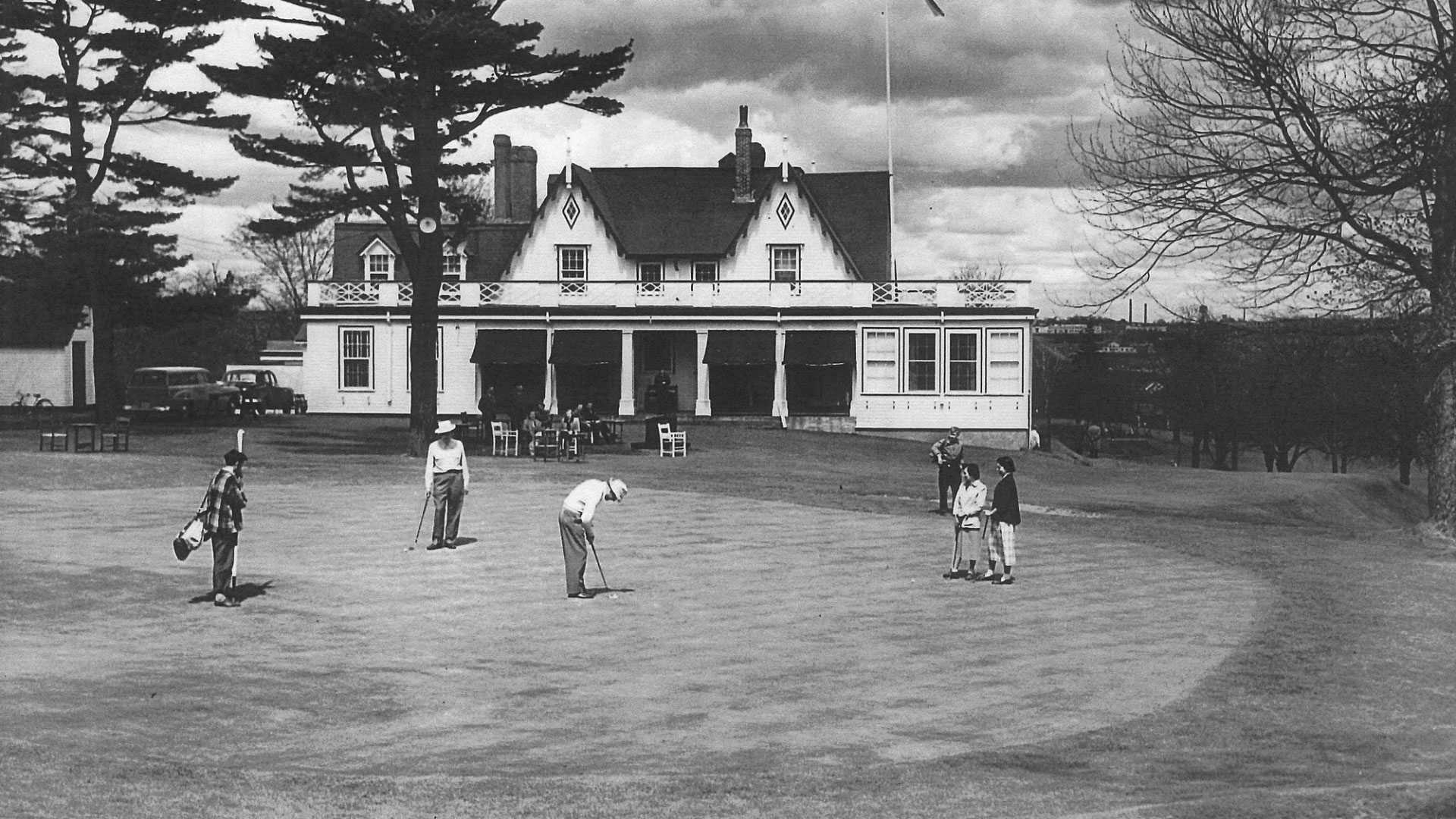 Old-Course-Clubhouse---Date-unknown_Men-playing-golf-on-a-grassy-field-Ashburn-GC